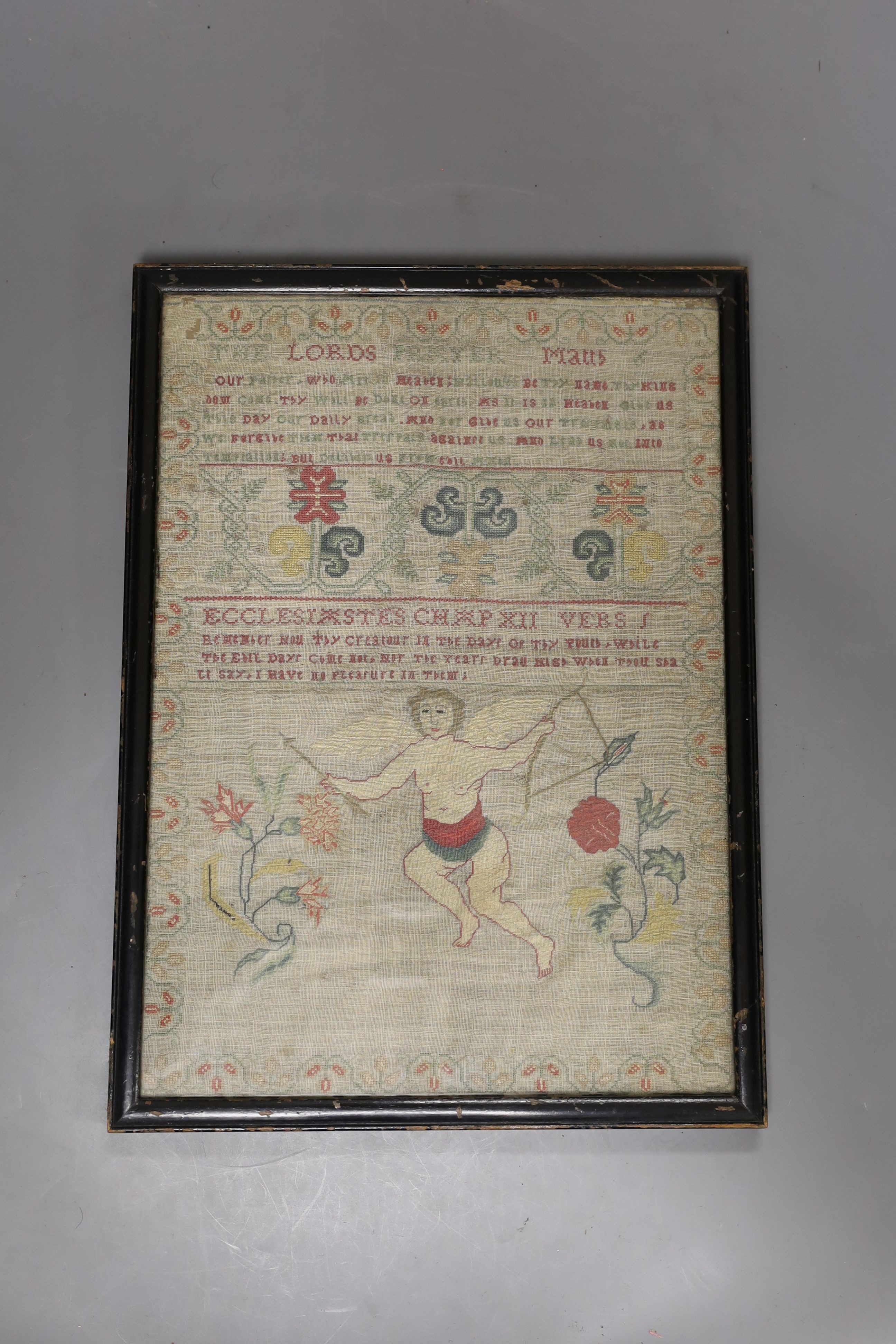 A George III finely embroidered Lords Prayer with angelic figure, flowers and text, 31 x 22cm, together with a later sampler, embroidered with house and trees, 35 x 29.5cm, both framed.
